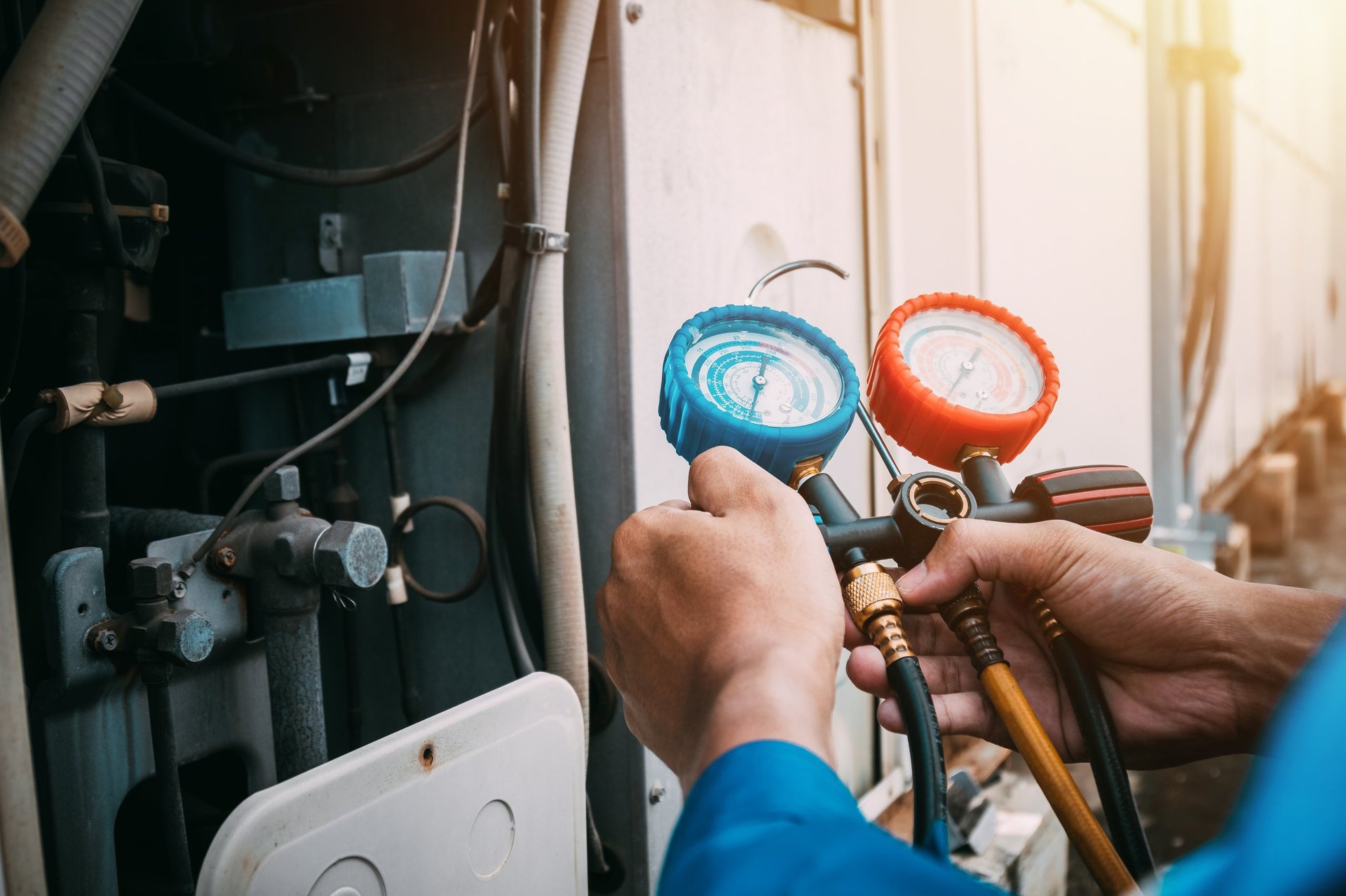HVAC technician checking air conditioner